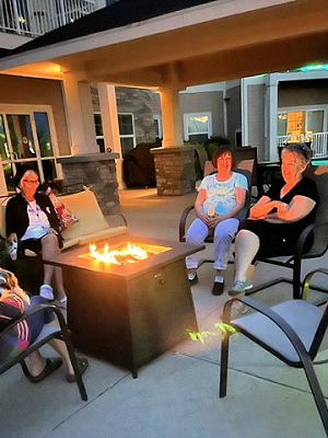 FiresideIMG_2108 four women around a campfire