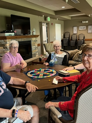 Trival Persut IIMG_2166 5 residents sitting around a table
